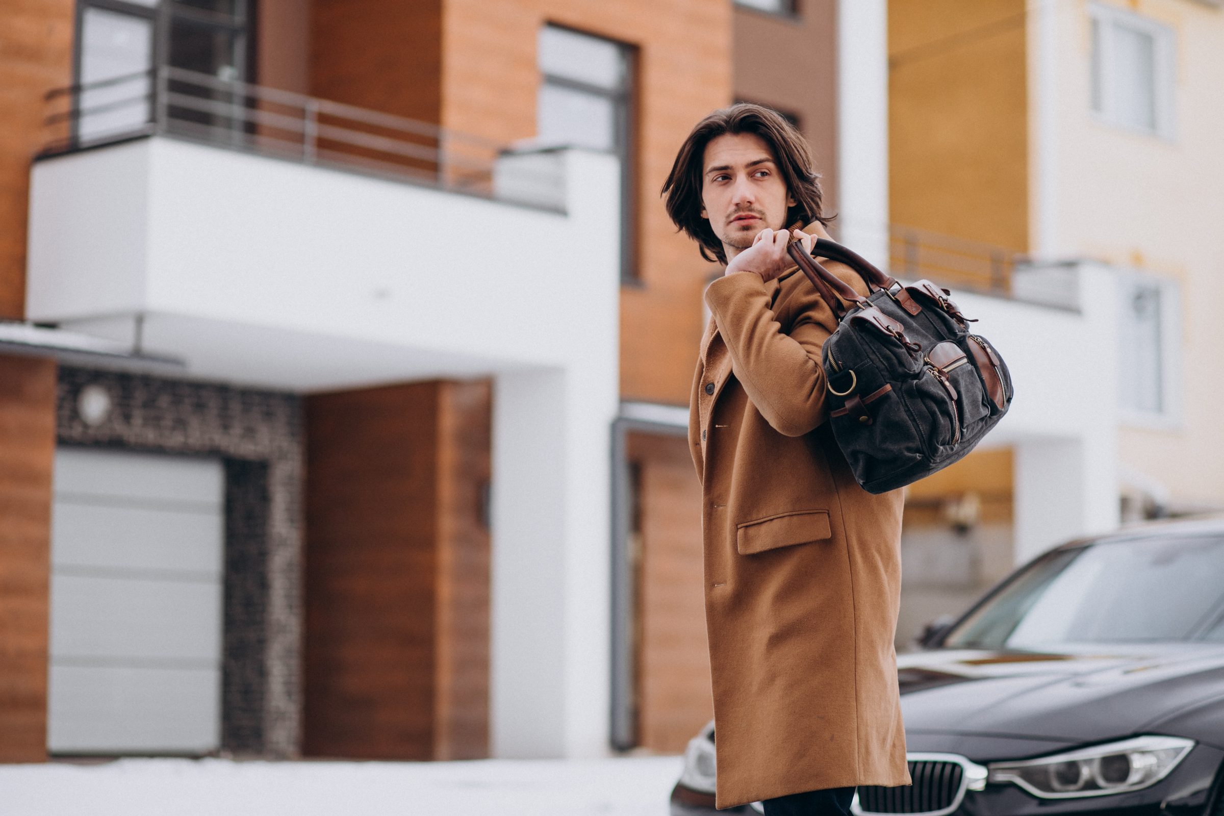 Businessman leaving home to car