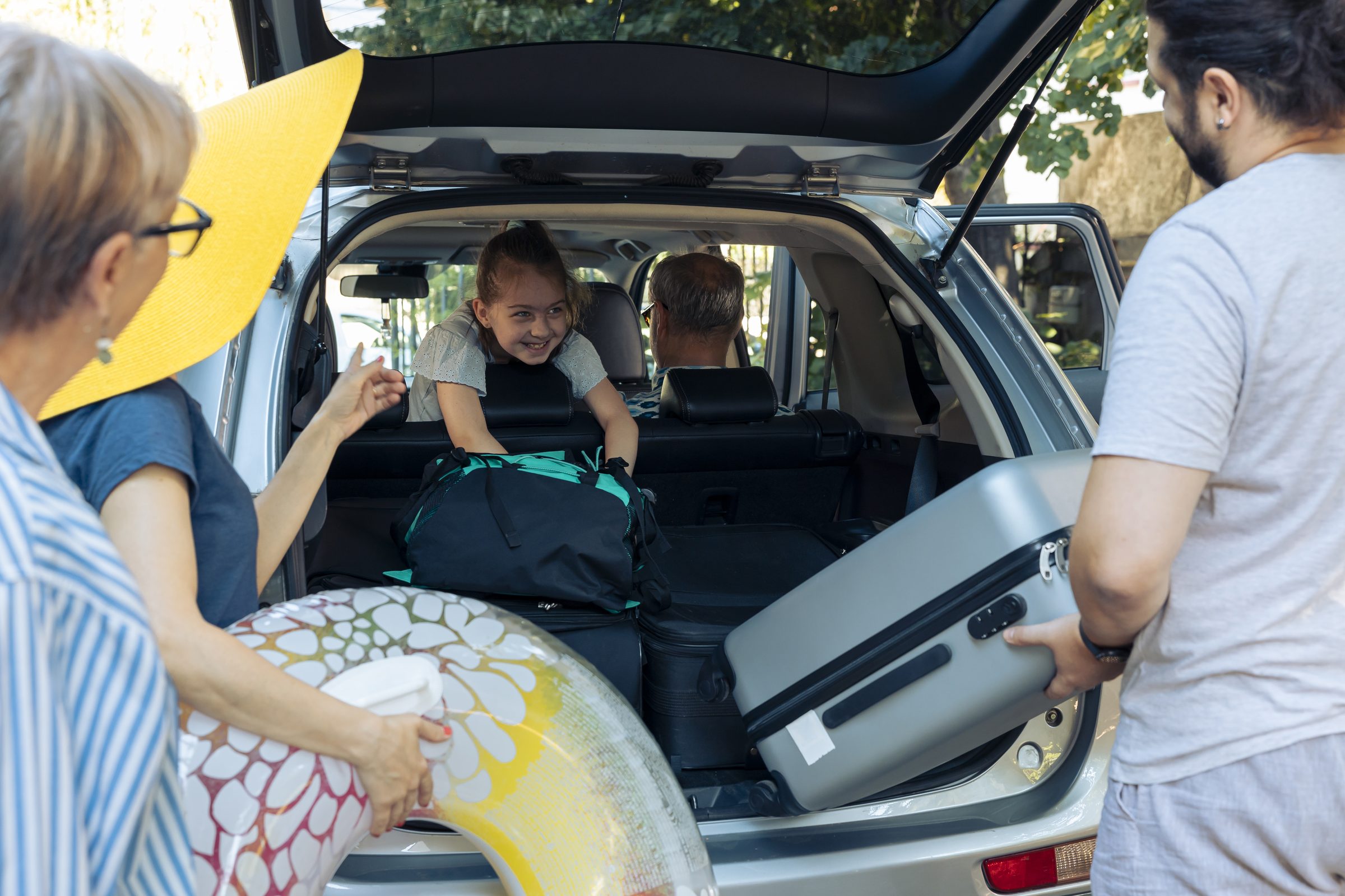 Family loading car holiday