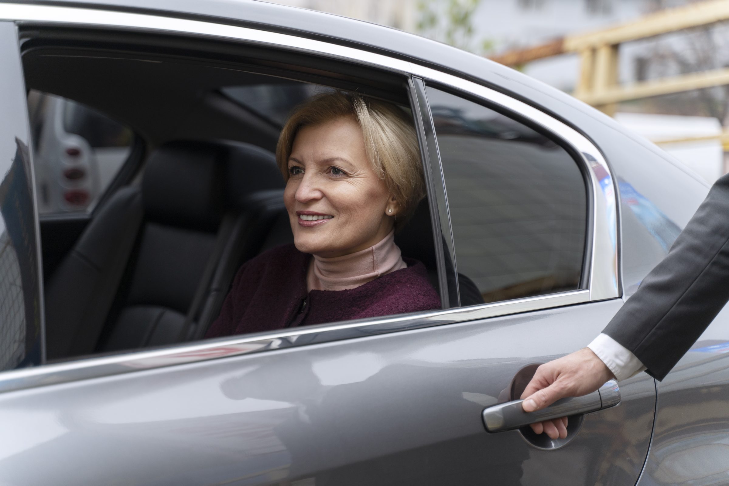 Passenger back seat smiling