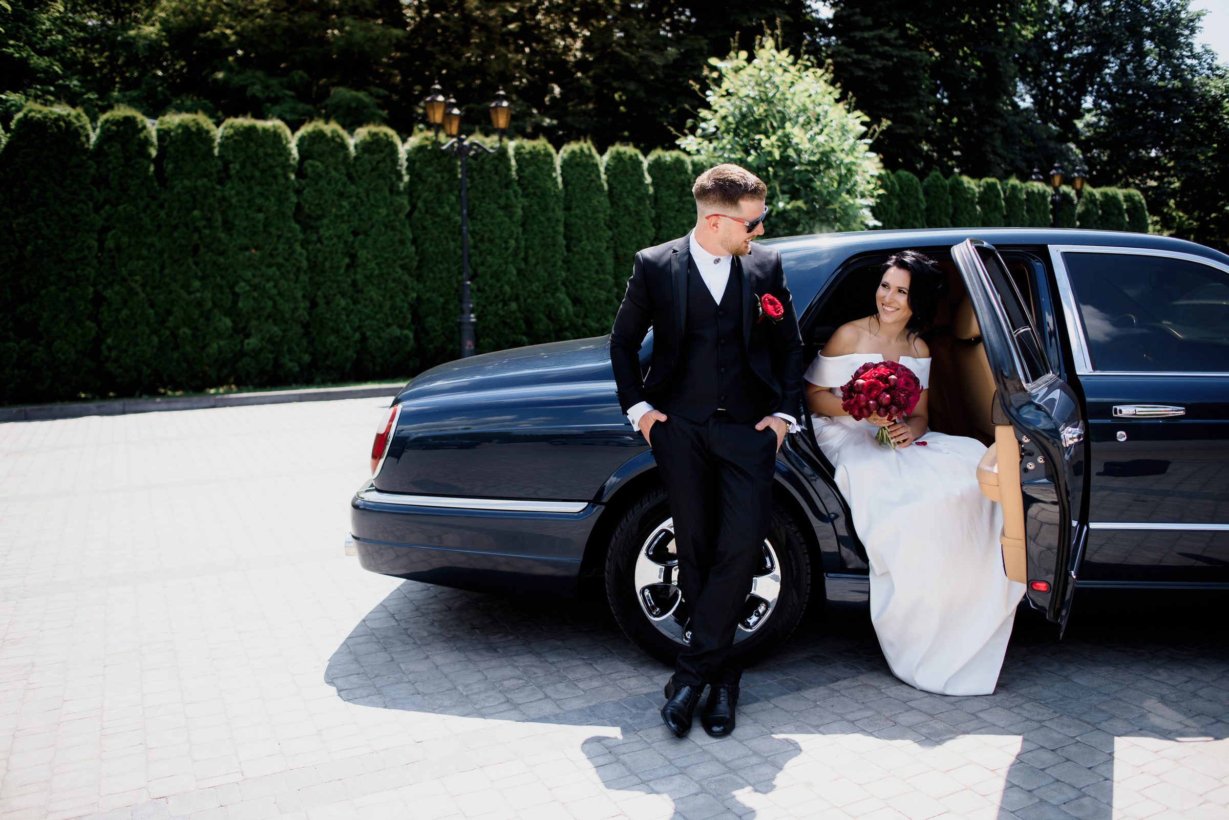 Wedding couple black car